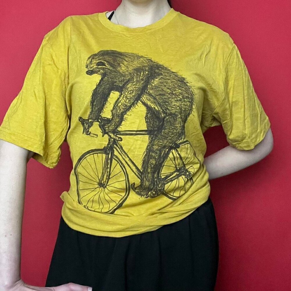 Dark cycle / Yellow tee shirt with graphic of a sloth​​​​​​​​​​​​
